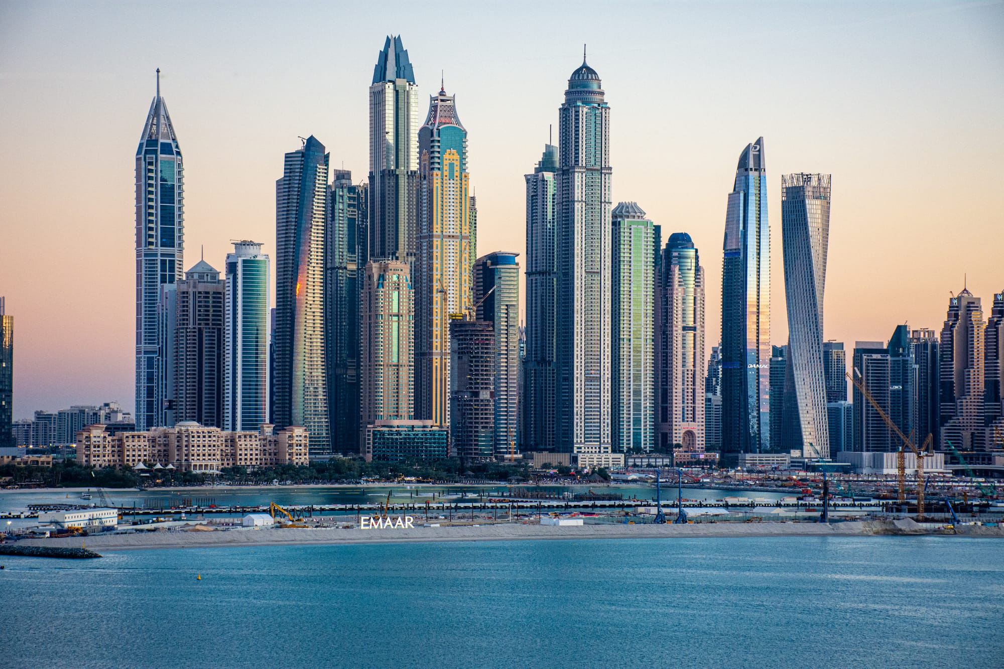 Dubai Marina towers reflected in the water at dusk